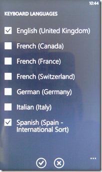 Windows phone 7 will let you switch languages easily, if the carrier allows it....