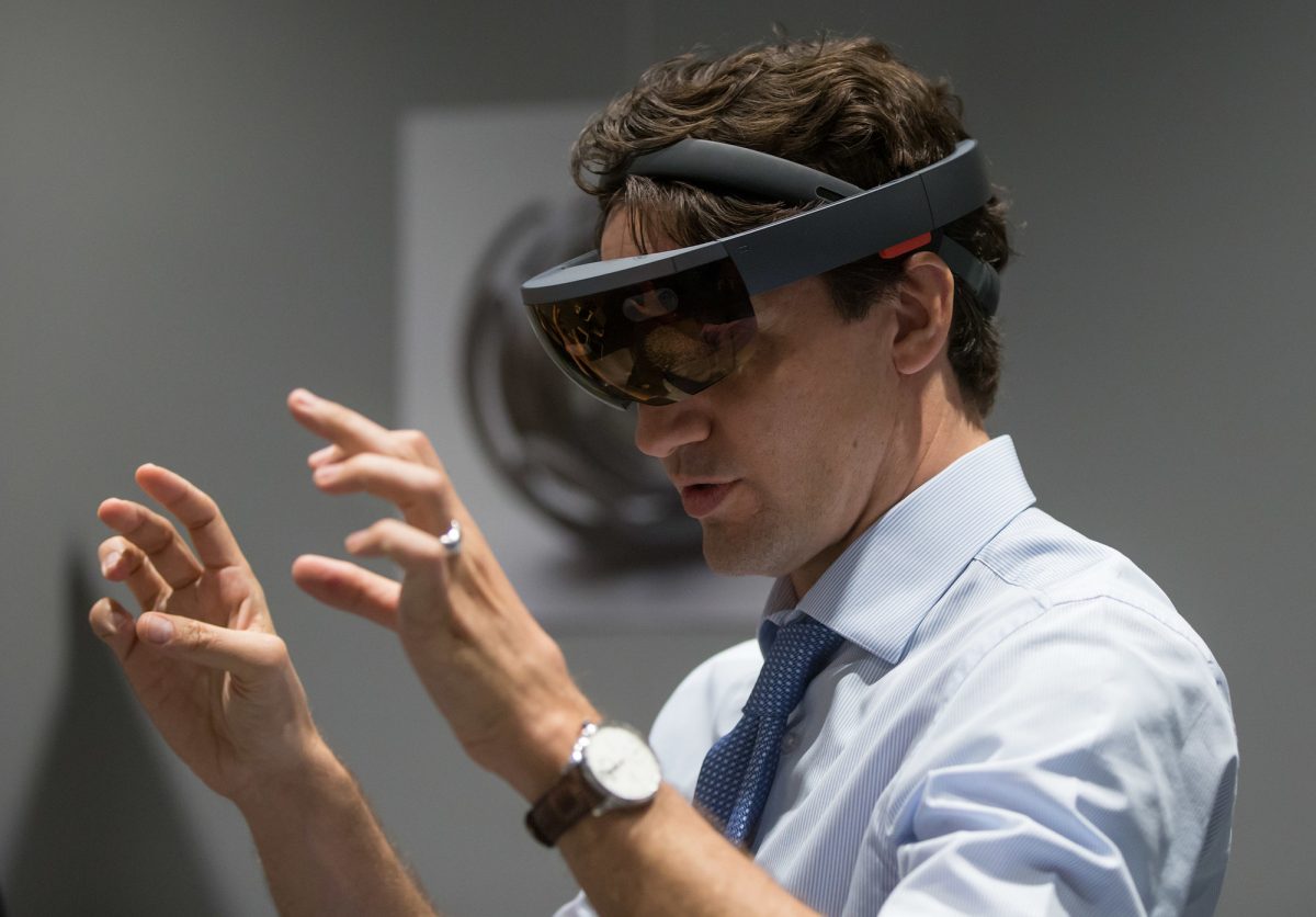 Prime Minister Justin Trudeau experiences Microsoft HoloLens at the official opening of the Microsoft Canada Excellence Centre today in Vancouver. The facility is designed to be an incubator of new technological talent and innovation. (CNW Group/Microsoft Canada Inc.)