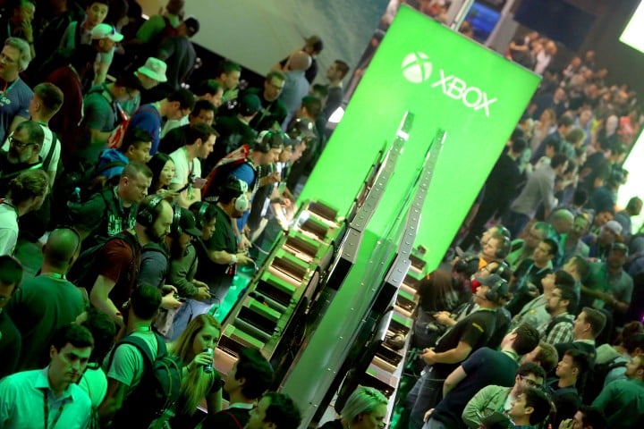E3 2016 attendees interact with newly announced games and experiences at the Xbox booth at E3 2016 in Los Angeles on Tuesday, June 16, 2016. (Photo by Casey Rodgers/Invision for Microsoft/AP Images)