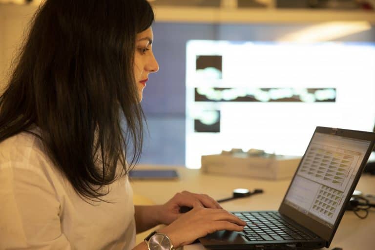 Novartis scientist using laptop