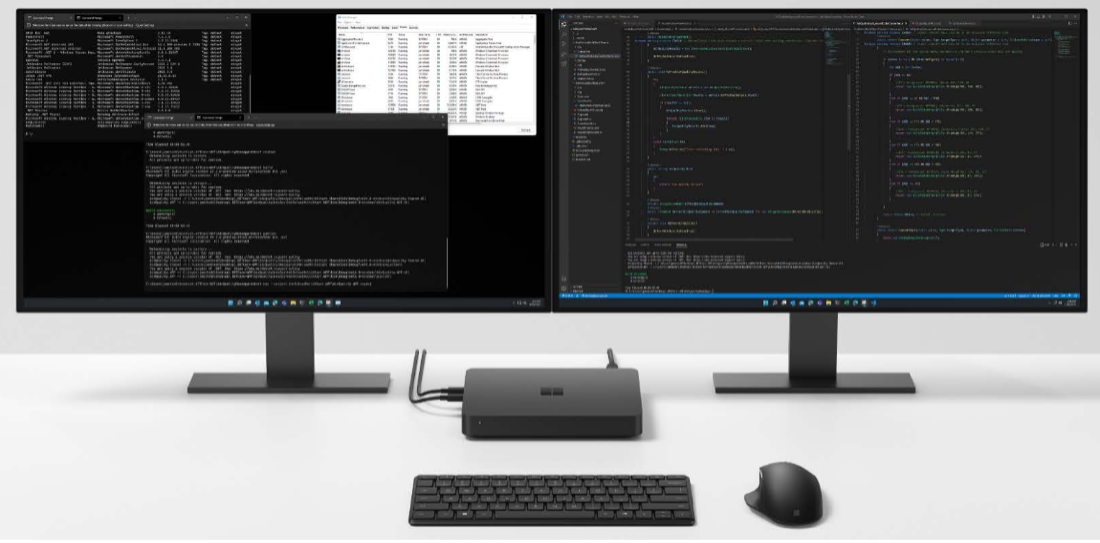 Windows Dev Kit 2023 connected to two monitors with computer mouse and keyboard