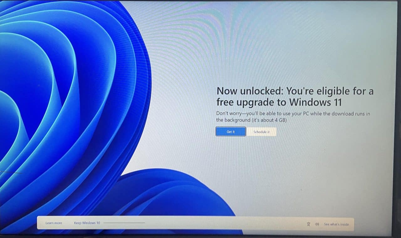 Windows 10 PC showing a full-screen Windows 11 upgrade ad